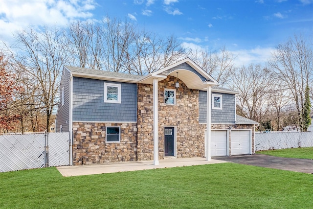 view of front of home featuring a garage and a front lawn