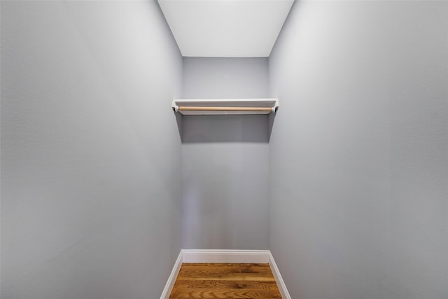 spacious closet with hardwood / wood-style floors