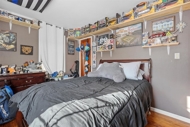 bedroom with wood-type flooring