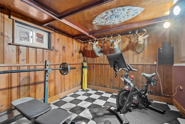 exercise area featuring wooden walls