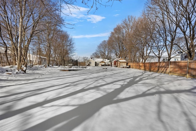 view of yard layered in snow