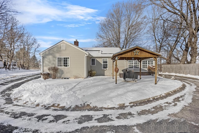 snow covered house with a gazebo