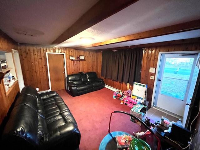 cinema room featuring baseboard heating, beamed ceiling, and wooden walls