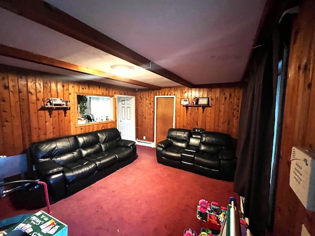 carpeted home theater with baseboard heating, beamed ceiling, and wooden walls