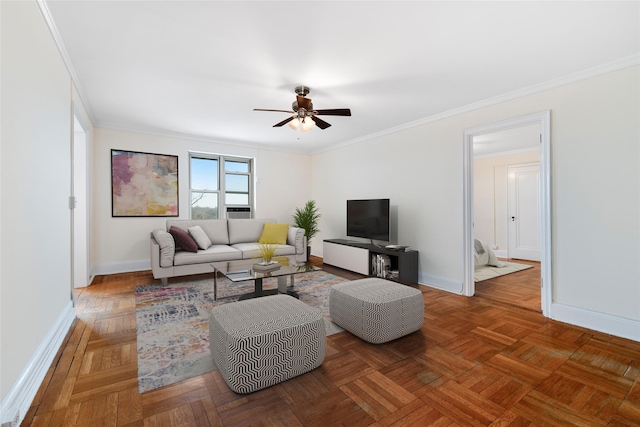 living room with dark parquet flooring, ornamental molding, and ceiling fan