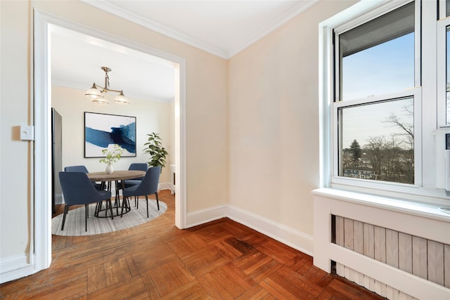 hall featuring dark parquet flooring, a notable chandelier, ornamental molding, and radiator heating unit