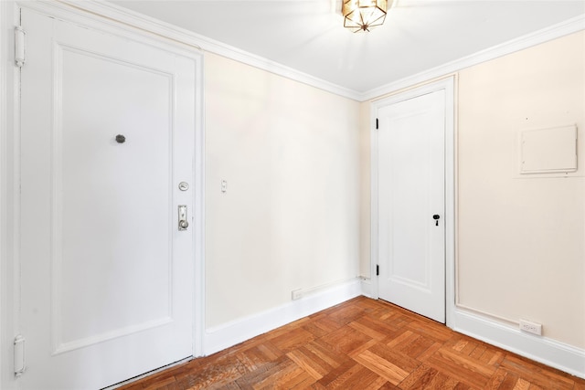 foyer entrance featuring ornamental molding and light parquet floors