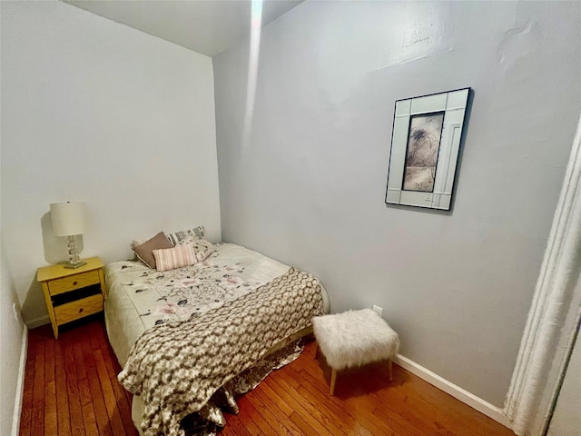 bedroom featuring dark hardwood / wood-style flooring