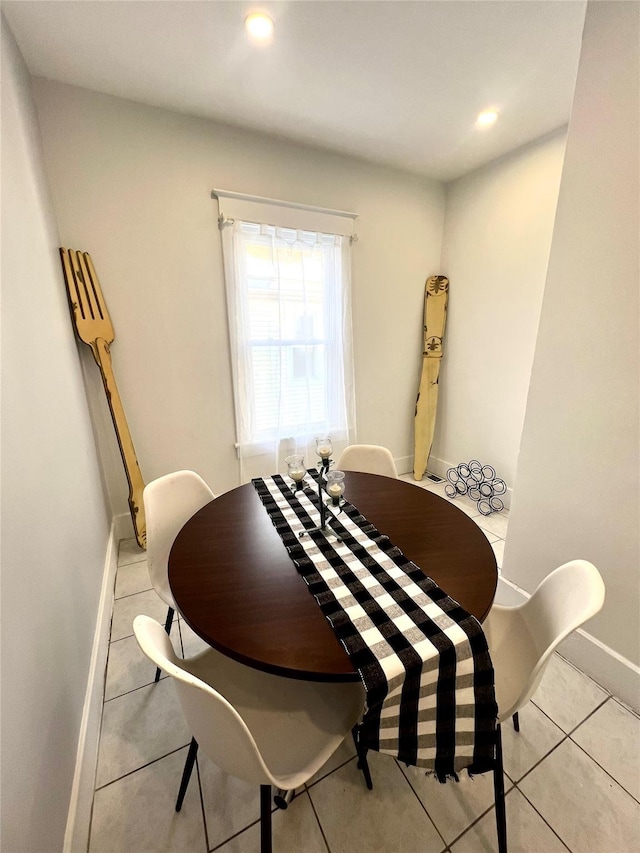 dining area featuring light tile patterned floors