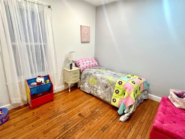 bedroom with hardwood / wood-style floors