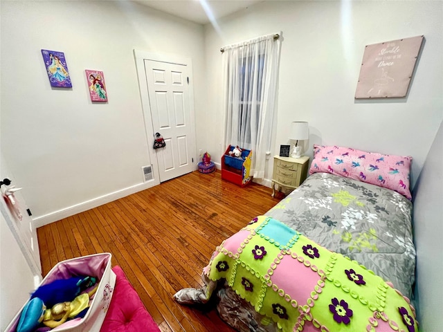 bedroom featuring hardwood / wood-style floors