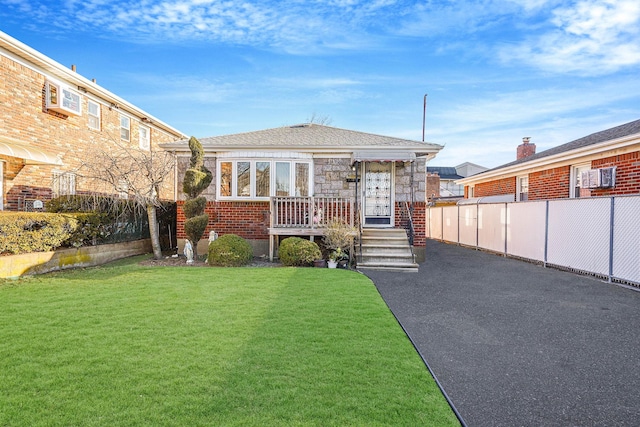 view of front of home with a front lawn