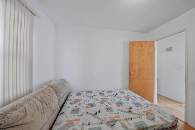 bedroom with light wood-type flooring