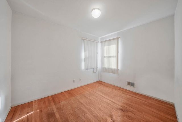 spare room featuring hardwood / wood-style floors