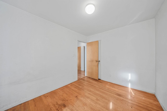 spare room featuring light wood-type flooring