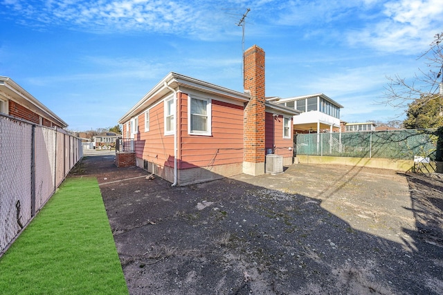 exterior space with cooling unit and a patio area