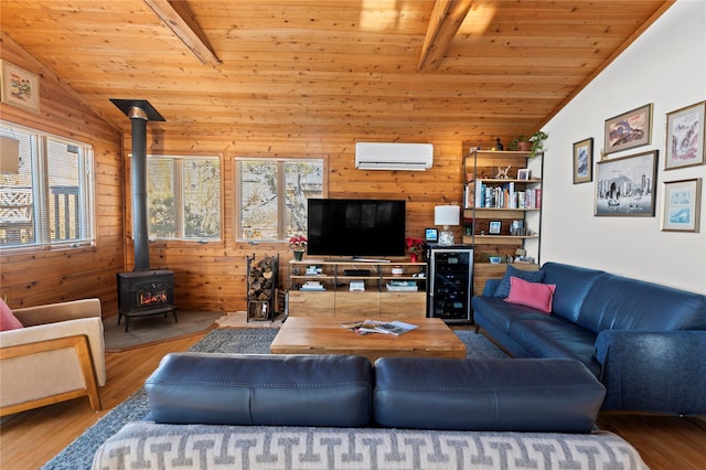 living room with lofted ceiling with beams, a wall mounted AC, a wood stove, and wooden ceiling