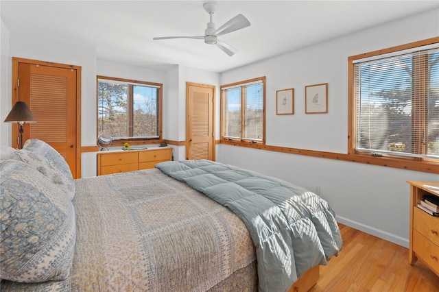 bedroom featuring ceiling fan and light hardwood / wood-style floors