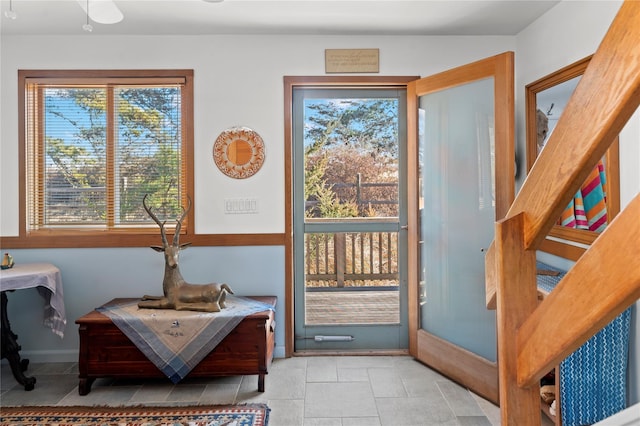 doorway with light tile patterned floors