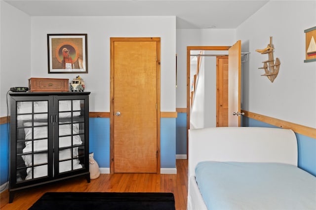 bedroom with wood-type flooring