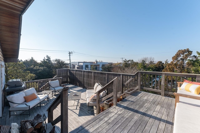 wooden deck featuring outdoor lounge area