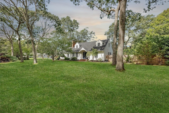 view of front of home with a yard