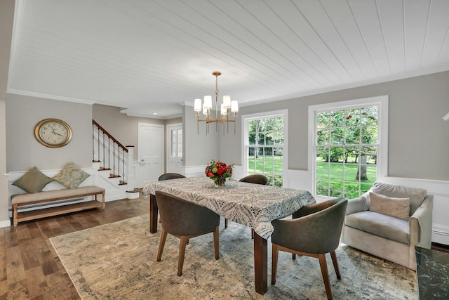 dining space featuring ornamental molding, baseboard heating, wooden ceiling, a notable chandelier, and dark hardwood / wood-style floors