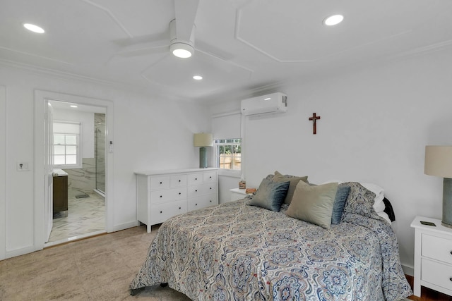 bedroom with a wall mounted air conditioner, ensuite bathroom, ceiling fan, and crown molding