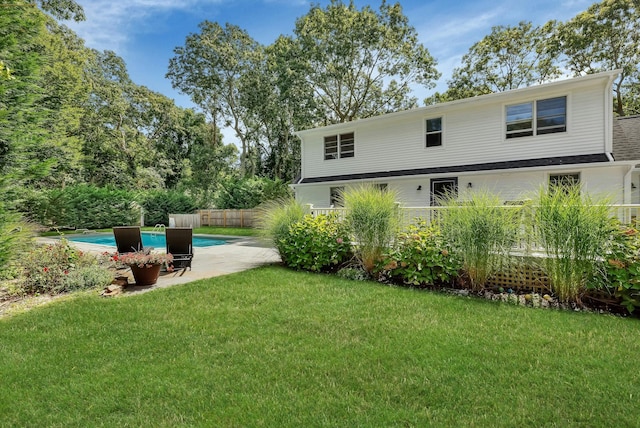 view of yard with a patio area and a fenced in pool