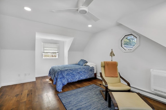 bedroom with multiple windows, ceiling fan, lofted ceiling, and a baseboard heating unit