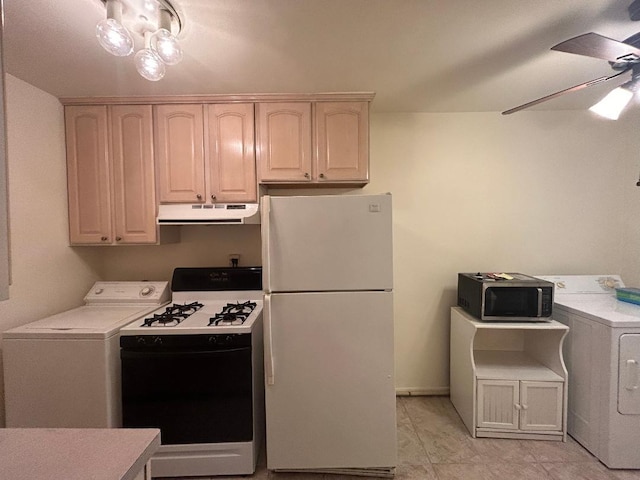 kitchen featuring white appliances, washer / clothes dryer, and ceiling fan