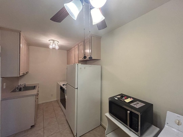 kitchen featuring ceiling fan, sink, light tile patterned floors, range, and white fridge