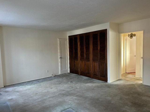 unfurnished bedroom with carpet floors and a closet