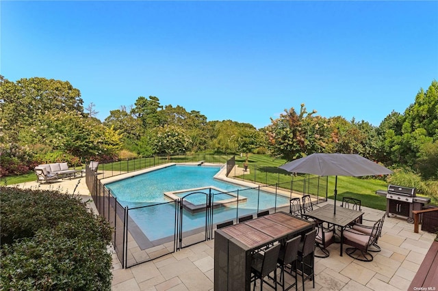 view of pool featuring area for grilling, a patio area, a yard, and an in ground hot tub