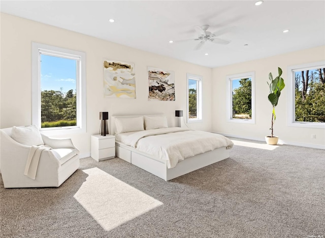 carpeted bedroom featuring ceiling fan