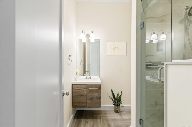 bathroom with vanity, parquet floors, and walk in shower