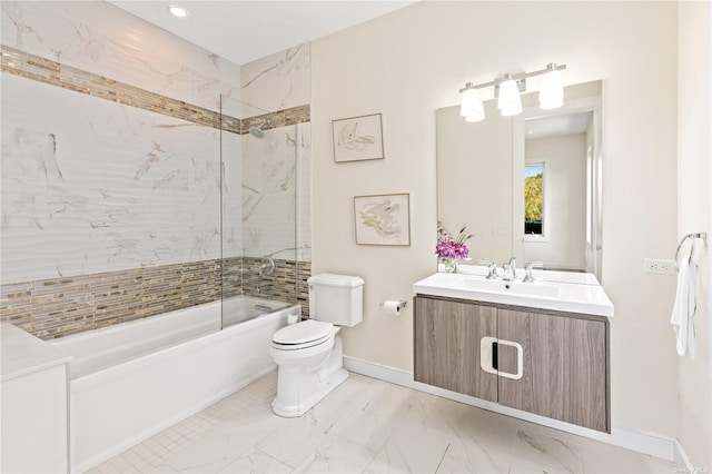 full bathroom featuring vanity, toilet, and tiled shower / bath combo