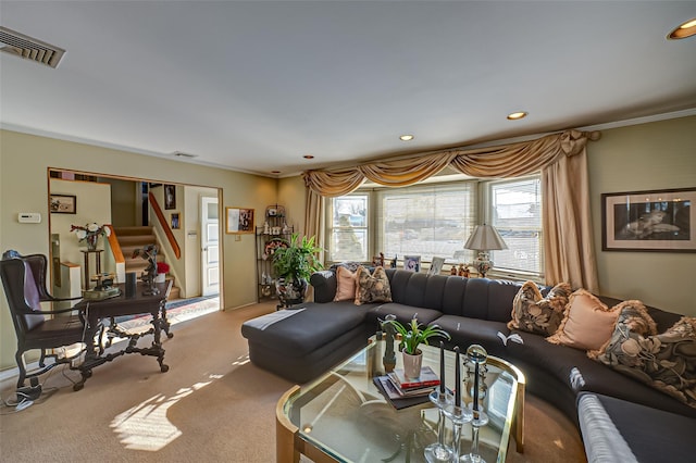 carpeted living room with crown molding