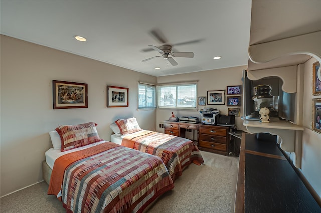 bedroom featuring ceiling fan and light colored carpet