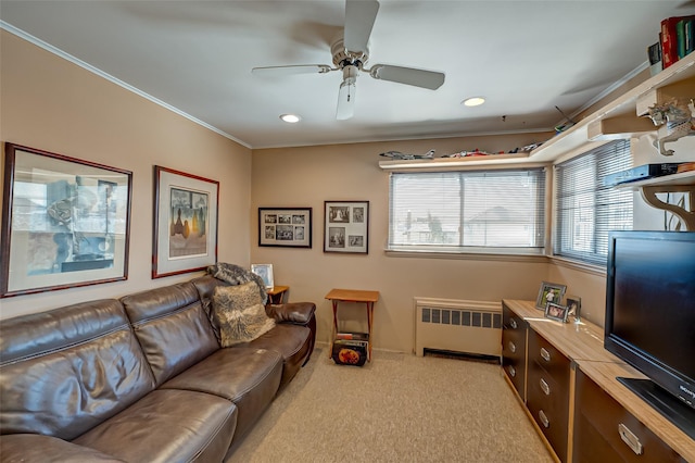 living room featuring crown molding, radiator, light carpet, and ceiling fan