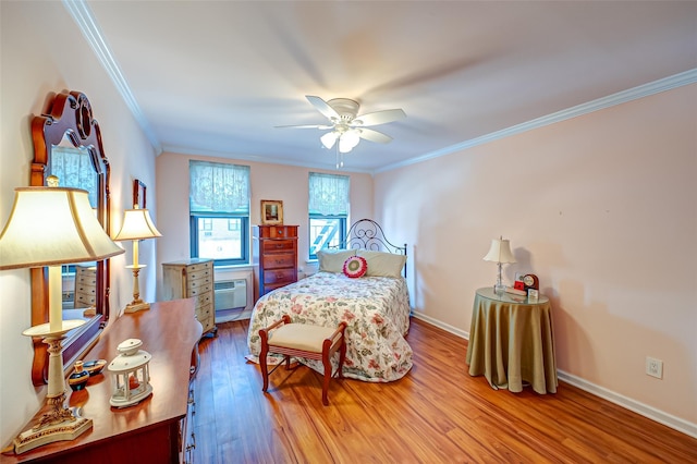 bedroom with hardwood / wood-style flooring, ceiling fan, crown molding, and an AC wall unit