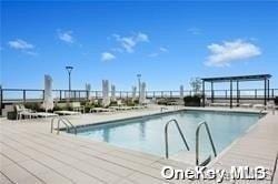 view of pool featuring a patio area