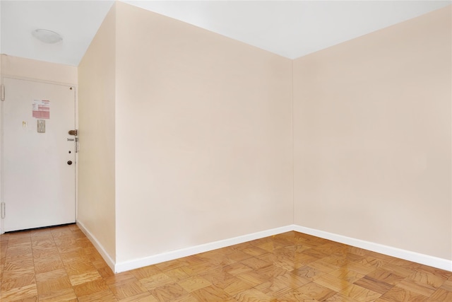 empty room with light parquet floors