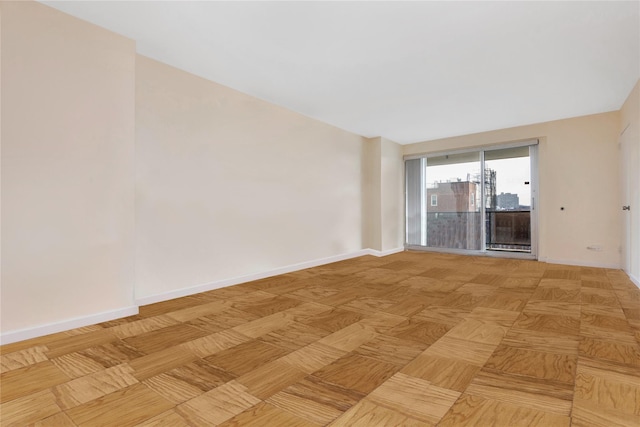 spare room featuring light parquet flooring