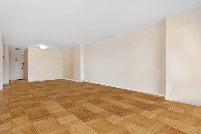 unfurnished room with light parquet floors