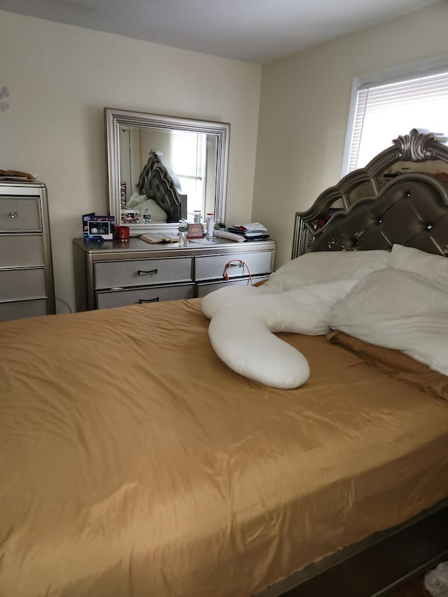 bedroom featuring multiple windows