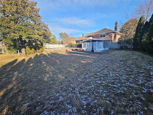 view of yard with a sunroom