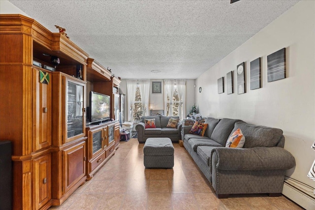 living room with baseboard heating and a textured ceiling