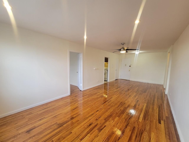 spare room featuring hardwood / wood-style flooring and ceiling fan