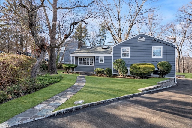 ranch-style house with a front lawn